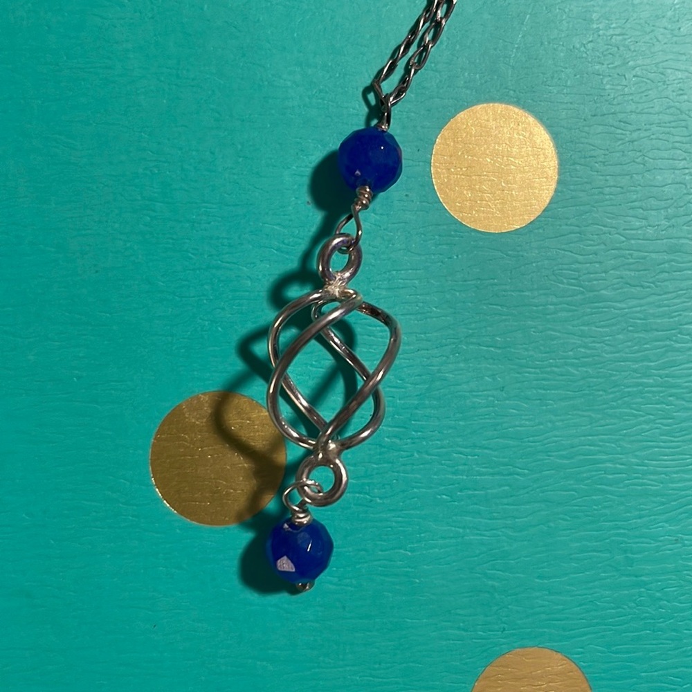 BNWT Sterling Silver with twist pendant and two blue beads